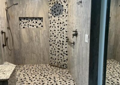 pebble stone mosaic shower stall | Stone saver